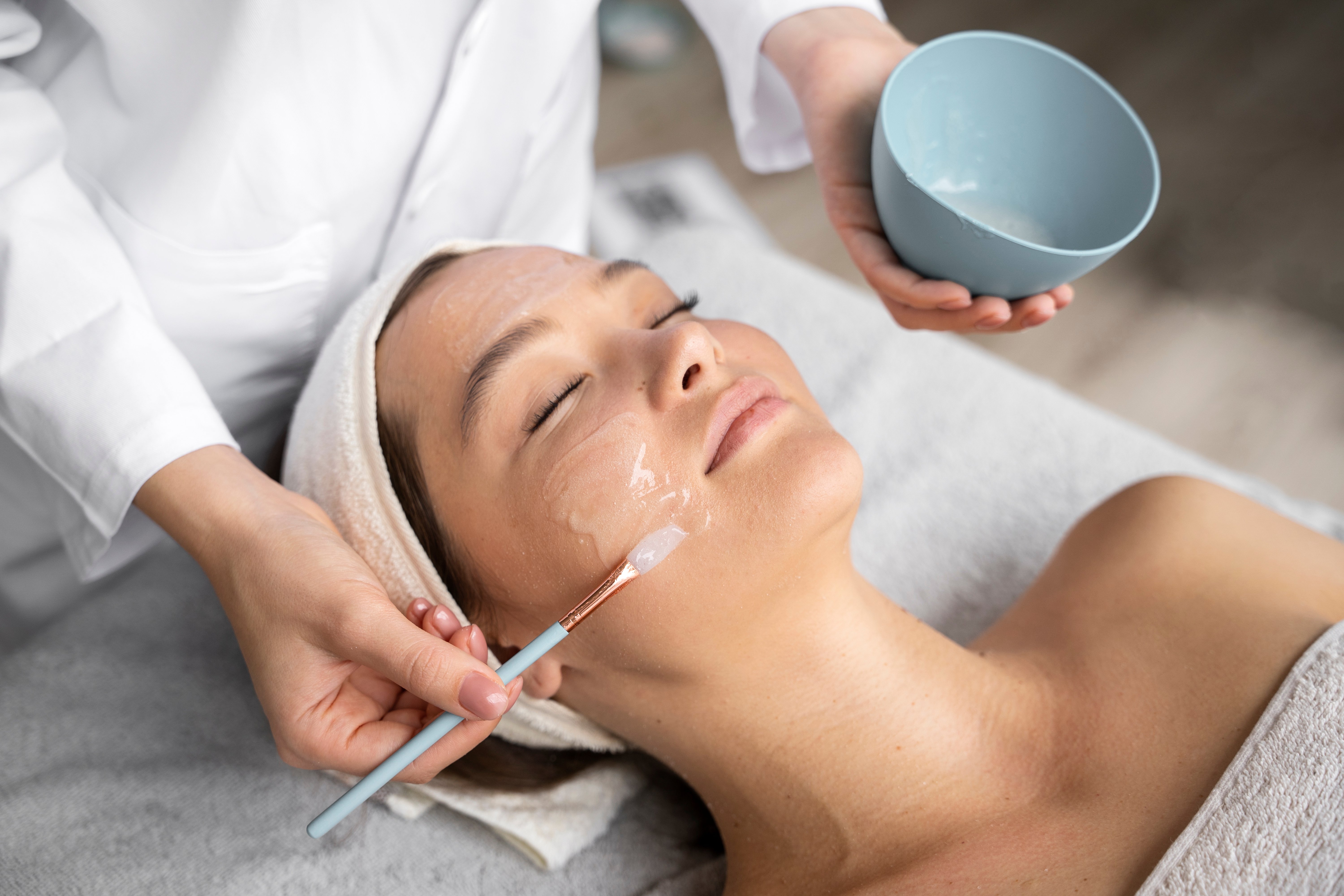 high-angle-woman-getting-massaged-spa